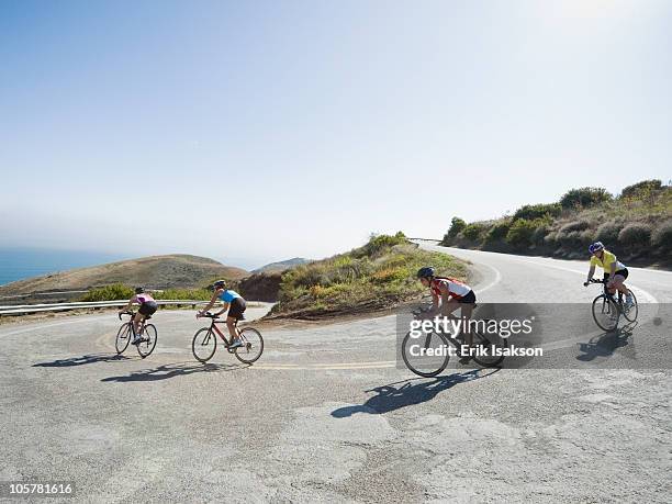 cyclists road riding in malibu - women road cycling stock pictures, royalty-free photos & images