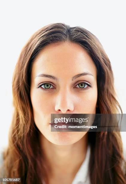 brunette with a blank expression - brunette woman foto e immagini stock