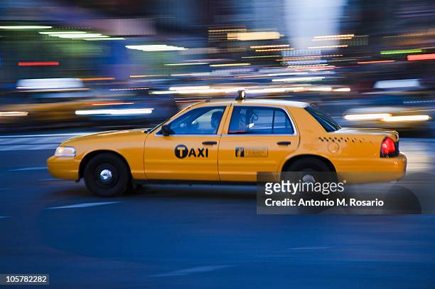 taxi cab driving in the evening - taxi stock pictures, royalty-free photos & images