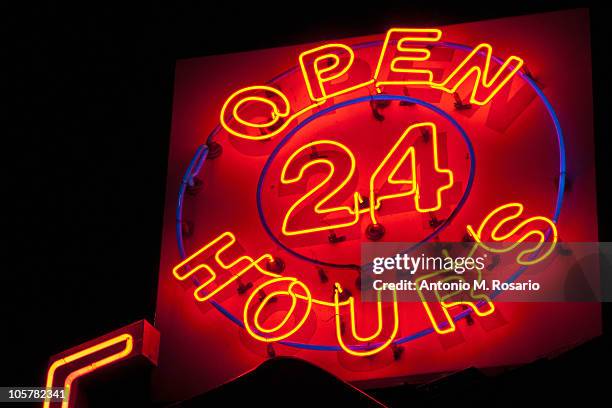 illuminated open 24 hours sign - 24 7 stock-fotos und bilder