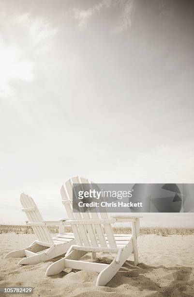 adirondack chairs on the beach - adirondack chair stockfoto's en -beelden