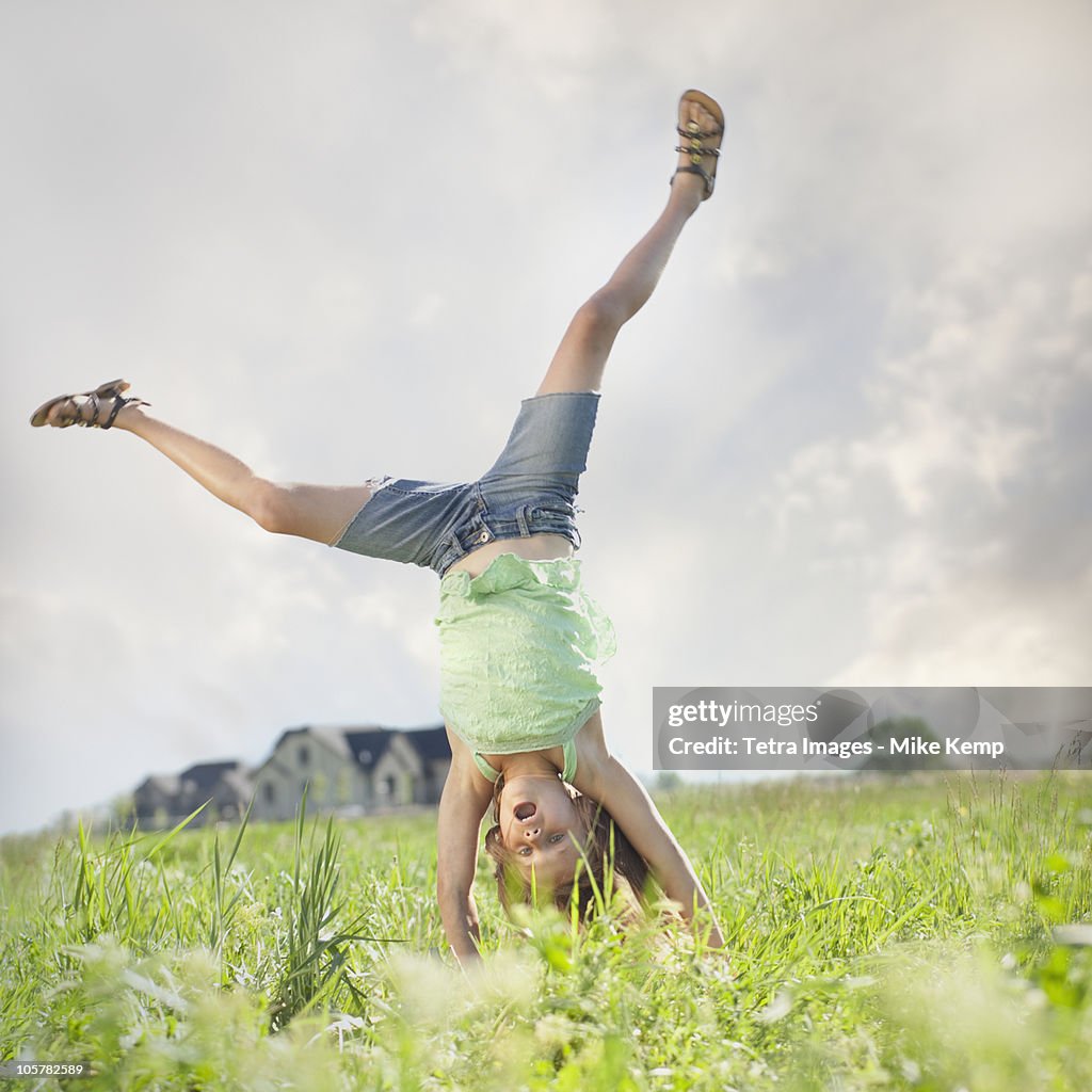 Young girl doing cartwheel