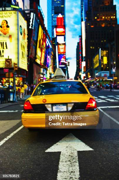 times square new york city at dusk - yellow taxi stock pictures, royalty-free photos & images