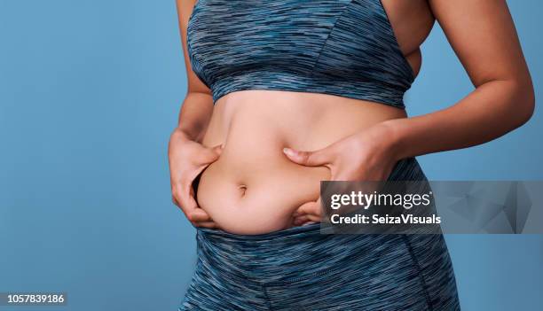 how do i get rid of this? - dieting women human abdomen stock pictures, royalty-free photos & images