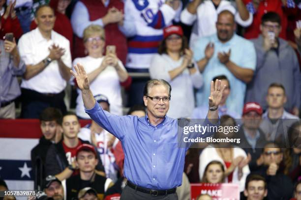 Mike Braun, Republican U.S. Senate candidate from Indiana, waves during a rally with U.S. President Donald Trump in Fort Wayne, Indiana, U.S., on...