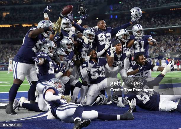 The Dallas Cowboys defensive line poses for a photo in the end zone after a fumble recovery against the Tennessee Titans in the first quarter of a...