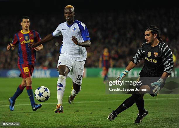 Dame N'Doye of FC Copenhagen tries to score past goalkeeper Jose Pinto of Barcelona during the UEFA Champions League group D match between Barcelona...