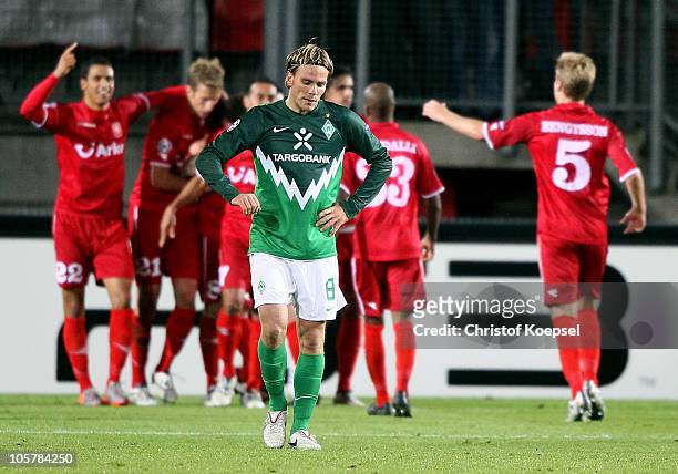 Clemens Fritz of Bremen looks dejected afte the first goal of Enschede during the UEFA Champions League group A match between FC Twente and SV Werder...