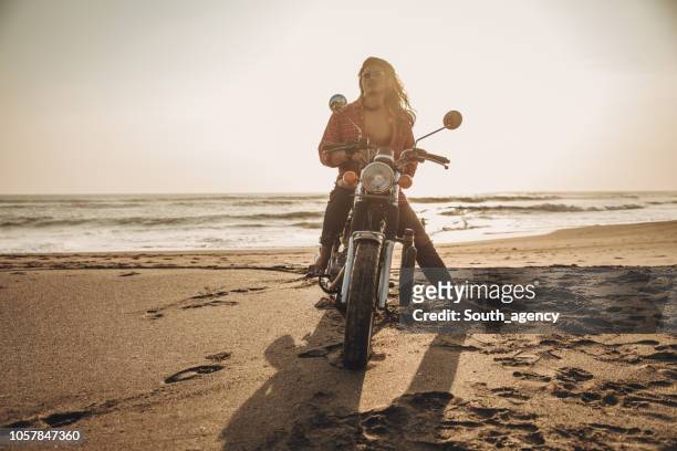 biker enjoying on the beach - hunky guy on beach stock pictures, royalty-free photos & images