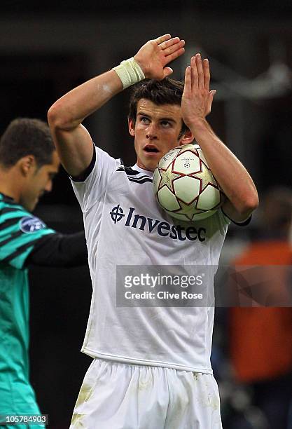 Gareth Bale of Tottenham Hotspur celebrates with the match ball after scoring a hat trick during the UEFA Champions League Group A match between FC...