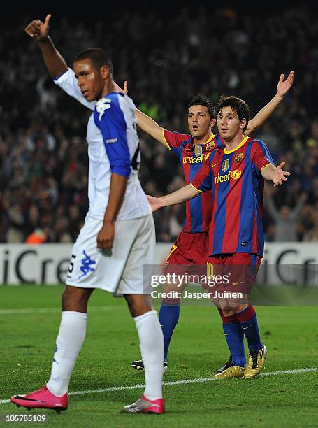 Lionel Messi of Barcelona reacts with his teammate David Villa after Messi's goal was disallowed during the UEFA Champions League group D match...