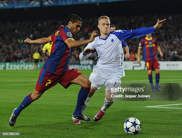 Daniel Alves of Barcelona duels for the ball with Oscar Wendt of FC Copenhagen during the UEFA Champions League group D match between Barcelona and...
