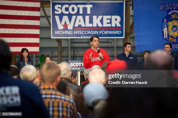 Governor Scott Walker speaks to supporters at a last minute get out the vote rally the night before the midterm elections at the Weldall Mfg., Inc....