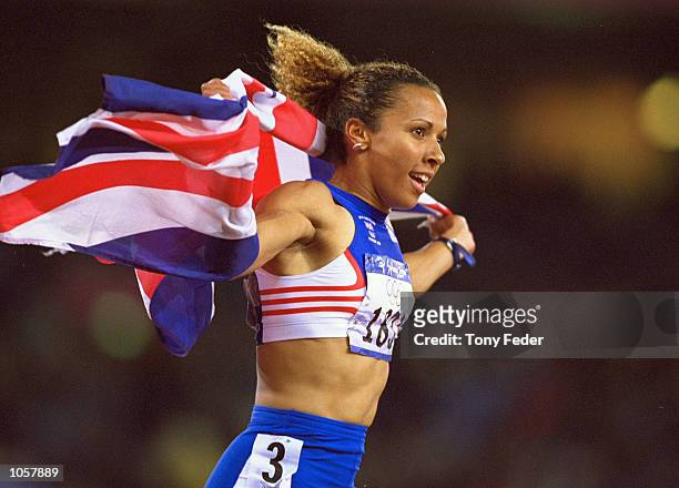 Kelly Holmes of Great Britain celebrates Bronze in the Womens 800m Final at the Olympic Stadium on Day Ten of the Sydney 2000 Olympic Games in...