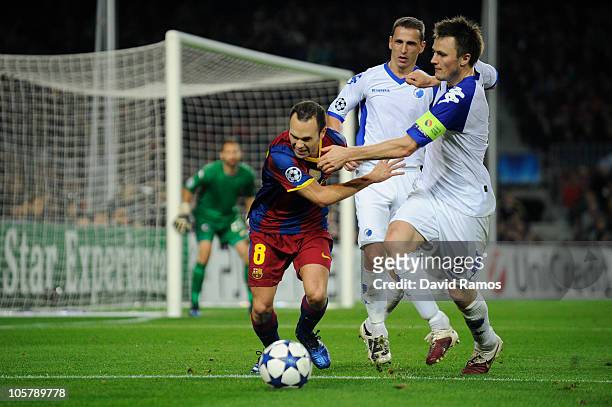 Andres Iniesta of Barcelona, William Kvist of FC Copenhagen and Zdenek Pspech of FC Copenhagen duel for a ball during the UEFA Champions League group...