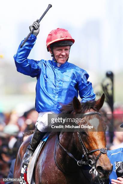 Jockey Kerrin McEvoy riding Cross Counter returns to scale after winning race 7 the Lexus Melbourne Cup during Melbourne Cup Day at Flemington...