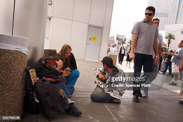 Group of homeless men and women sit on the sidewalk on Las Vegas Boulevard on October 20, 2010 in Las Vegas, Nevada. Nevada once had among the lowest...