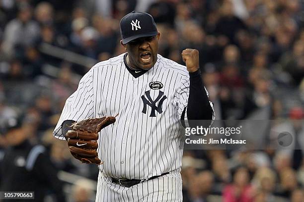 Sabathia of the New York Yankees celebrates after he forced Josh Hamilton of the Texas Rangers to ground into a double play to end the top of the...