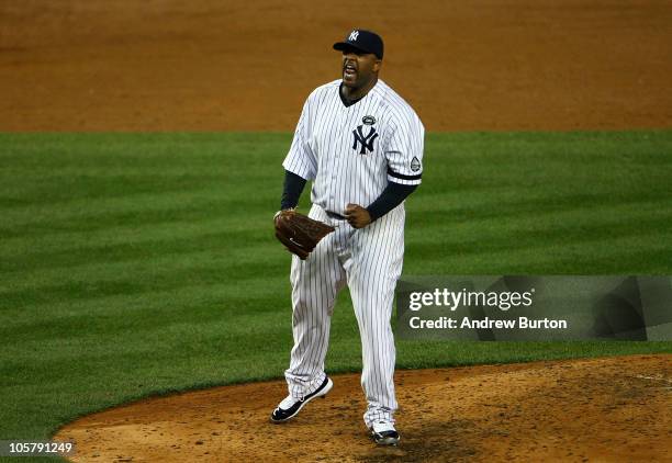 Sabathia of the New York Yankees reacts after he struck out Mitch Moreland of the Texas Rangers to end the top of the sixth inning of Game Five of...