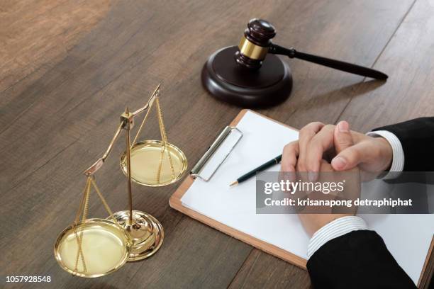 judge with scales,judge gavel with justice lawyers, businessman in suit or lawyer working on a documents. legal law, advice and justice concept. - tribunal ストックフォトと画像