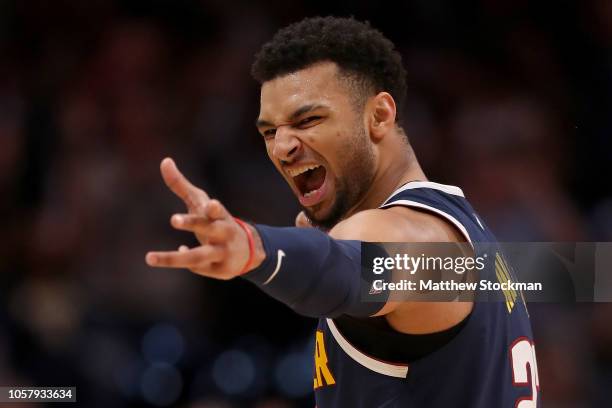 Jamal Murray of the Denver Nuggets celebrates a three point basket against the Boston Celtics in the fourth quarter at the Pepsi Center on November...