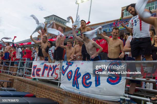 Student members of the club known as "Jerry's Jokers" at Liberty University cheer on the home football team on October 20, 2018 in Lynchburg,...