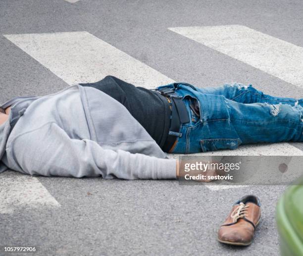 traffic accident. young man hit by a car - dead bodies in car accident photos stock pictures, royalty-free photos & images