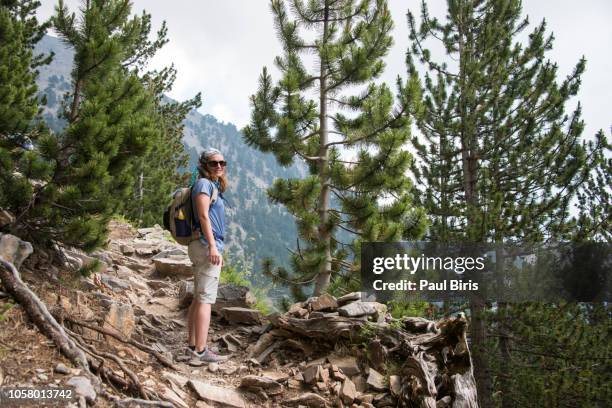 young woman hiking on mount olympus, greece - olympus imagens e fotografias de stock