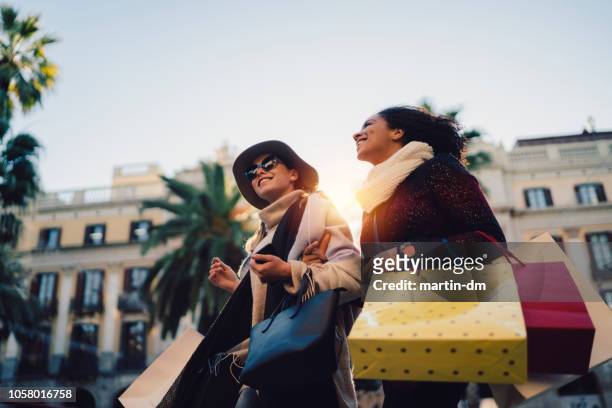 women shopping in barcelona - winter barcelona stock pictures, royalty-free photos & images