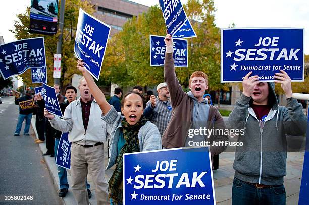 Supporters wave signs prior to the debate between U.S. Senate Republican candidate Pat Toomey and U.S. Senate Democratic candidate Congressman Joe...