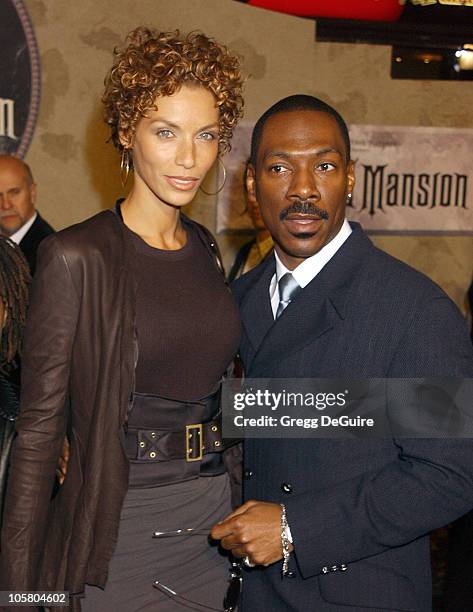 Nicole Murphy and Eddie Murphy during "The Haunted Mansion" World Premiere at El Capitan Theatre in Hollywood, California, United States.