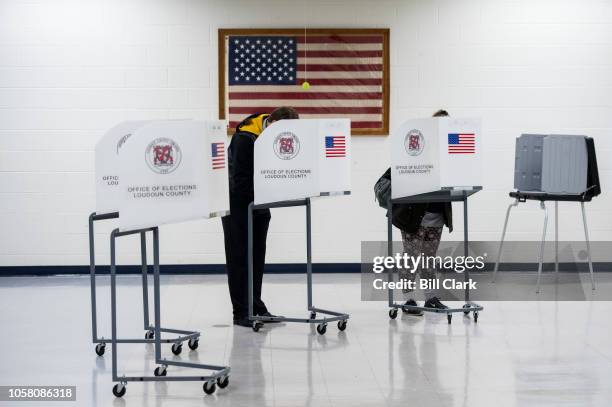 Voters fill out their ballots at Loudon County High School in Leesburg, Va., on election day, Nov. 6, 2018. The polling place is located in the...