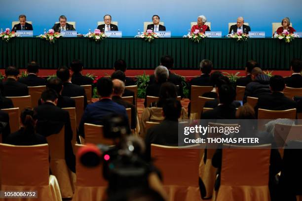Chair of the Financial Stability Board Mark Carney, World Trade Organisation Director-General Roberto Azevedo, World Bank President Jim Yong Kim,...