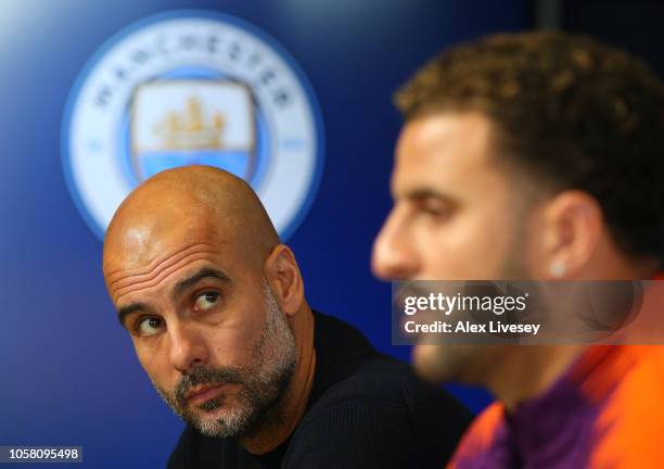 Josep Guardiola, Manager of Manchester City and Kyle Walker attend a Manchester City press conference at Manchester City Football Academy on November...