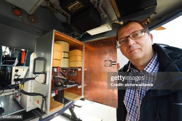November 2018, Mecklenburg-Western Pomerania, Lubmin: BfS operator Michael Thomas checks the semiconductor detector in the helicopter before...