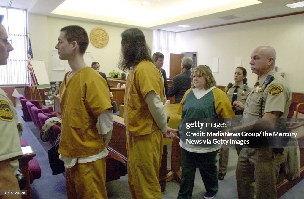 George Helzer Justin Helzer Glenn Taylor Helzer and Dawn Godman are escorted out of ...