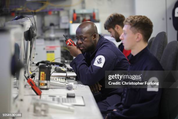 Engineers work in the ship control room onboard HMS Queen Elizabeth as it sails towards New York on October 19, 2018 in New York City. HMS Queen...