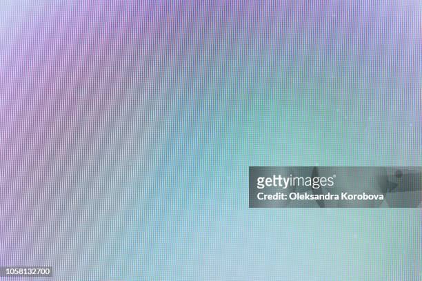 close-up of a colorful moire pattern on a computer screen. - computer screen fotografías e imágenes de stock
