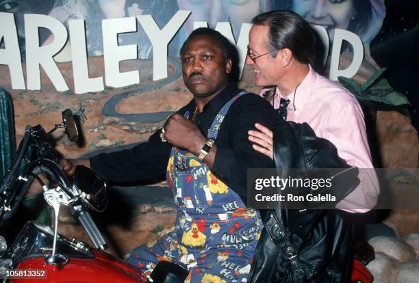 Joe Frazier and Peter Fonda during Grand Opening of The Harley Davidson Cafe at Harley Davidson Cafe in New York City, New York, United States.