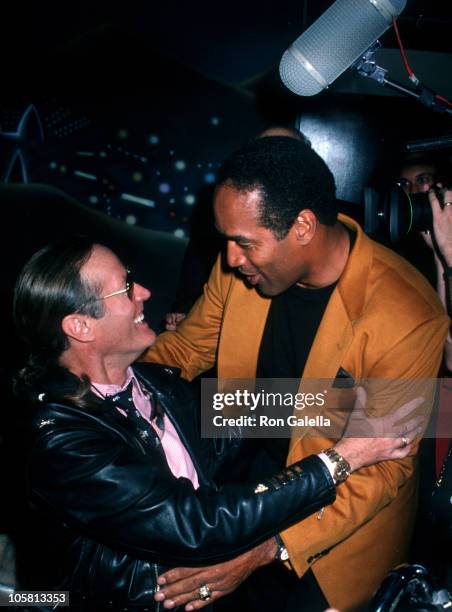 Peter Fonda and O.J. Simpson during Grand Opening of The Harley Davidson Cafe at Harley Davidson Cafe in New York City, New York, United States.