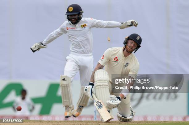 Ben Stokes of England is bowled as Niroshan Dickwella of Sri Lanka celebrates during the 1st Cricket Test Match between Sri Lanka and England at the...