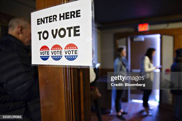 Voters wait in line to cast ballots at a polling station inside Hoyt Park Grand Hall in Wauwatosa, Wisconsin, U.S., on Tuesday, Nov. 6, 2018. More...