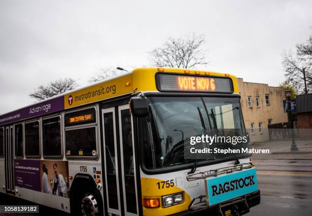 City bus displays text reading "Vote Nov 6" on Election Day, November 6, 2018 in Minneapolis, Minnesota. Voters in Minnesota will be deciding the...