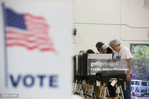 Voters cast their ballots at a polling station set up at Grady High School for the mid-term elections on November 6, 2018 in Atlanta, Georgia....