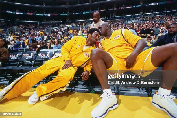 Kobe Bryant and Shaquille O'Neal of the Los Angeles Lakers talk on the bench during a game played circa 2000 at the Staples Center in Los Angeles,...