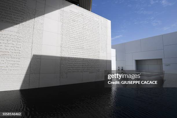 Picture taken on November 6, 2018 shows visitors at the Louvre Abu Dhabi museum, in the Emirati capital. - The museum, designed by the French...