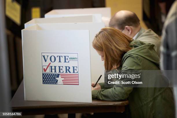 Voters cast ballots at a polling place on November 6, 2018 in Kirkwood, Missouri. Voters across the country are casting ballots in a midterm election...