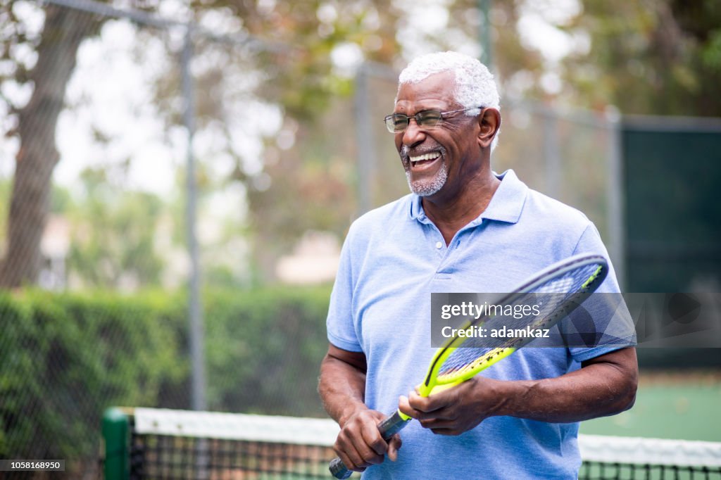 Senior Black Man Playing Tennis