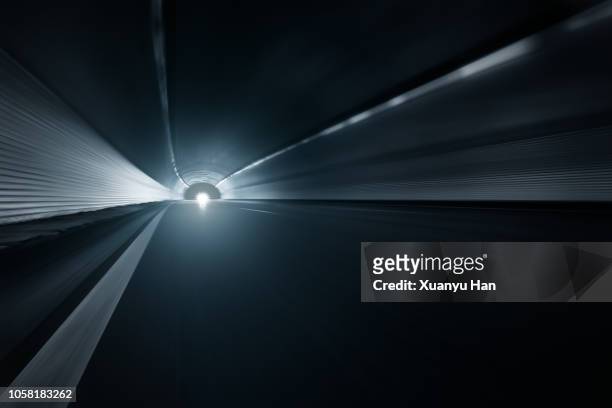 modern highway tunnel underpass - futuristic circuit stockfoto's en -beelden