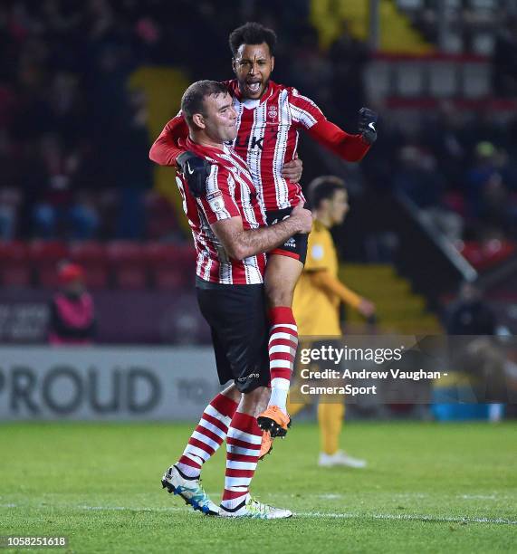 Lincoln City's Matt Green,right celebrates scoring the opening goal with team-mate Matt Rhead during the Checkatrade Trophy Northern Group H match...